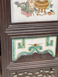 A rare Chinese eight-panel hongmu room divider with 48 qianjiang cai plaques, signed Jia Xingqing 贾醒卿, dated 1902
