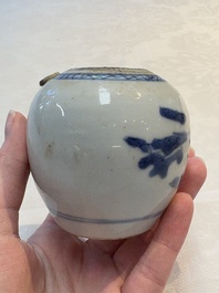 A Chinese famille verte covered vase, a pair of blue and white jars on wooden stands and two jars, 19th C.
