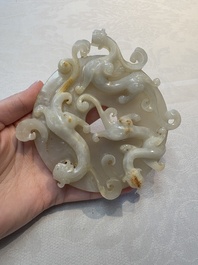 A Chinese carved white and russet jade bi-disc with chilong design, 19/20th C.