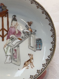A Chinese iron-red-decorated 'boy and buffalo' cup and saucer and a famille rose 'Xi Xiang Ji' cup and saucer, Qianlong