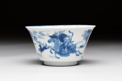 A Chinese blue and white 'Mongolian hunting' cup and saucer, jade mark, Kangxi