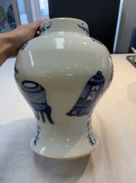 A Chinese blue and white vase and cover with calligraphy and antiquities, 19th C.