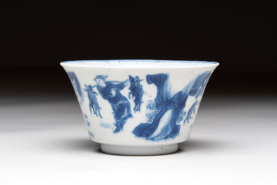A Chinese blue and white 'Mongolian hunting' cup and saucer, jade mark, Kangxi