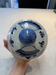 A Chinese blue and white vase and cover with calligraphy and antiquities, 19th C.