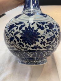 A Chinese blue and white 'flower scroll' bottle vase, Xuantong mark, 20th C.