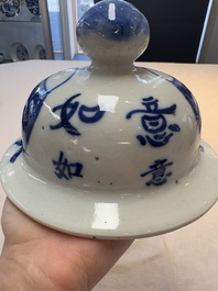 A Chinese blue and white vase and cover with calligraphy and antiquities, 19th C.