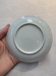 A Chinese famille rose saucer with two ladies and a boy, Yongzheng