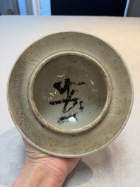 A Chinese blue and white vase and cover with calligraphy and antiquities, 19th C.