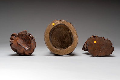 Three Chinese carved bamboo figures and a boxwood carving of a phoenix, 20th C.