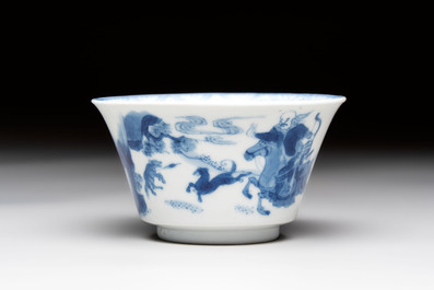 A Chinese blue and white 'Mongolian hunting' cup and saucer, jade mark, Kangxi