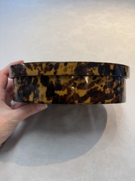 A fine and rare Chinese tortoiseshell-veneered and red-lacquered oval box and cover, signed Wang Wenzhi 王文治, Qianlong mark and of the period