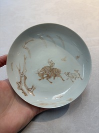 A Chinese iron-red-decorated 'boy and buffalo' cup and saucer and a famille rose 'Xi Xiang Ji' cup and saucer, Qianlong