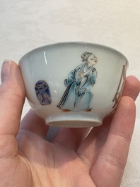A Chinese iron-red-decorated 'boy and buffalo' cup and saucer and a famille rose 'Xi Xiang Ji' cup and saucer, Qianlong