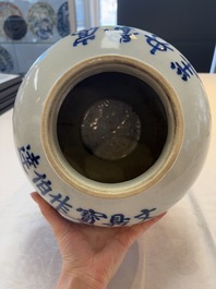 A Chinese blue and white vase and cover with calligraphy and antiquities, 19th C.