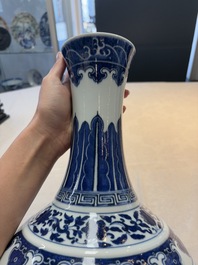 A Chinese blue and white 'flower scroll' bottle vase, Xuantong mark, 20th C.