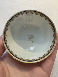 A Chinese iron-red-decorated 'boy and buffalo' cup and saucer and a famille rose 'Xi Xiang Ji' cup and saucer, Qianlong