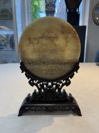 A pair of Chinese carved jade &lsquo;elephant&rsquo; plaques on wooden stands, 19th C.