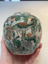 A Chinese famille verte covered vase, a pair of blue and white jars on wooden stands and two jars, 19th C.