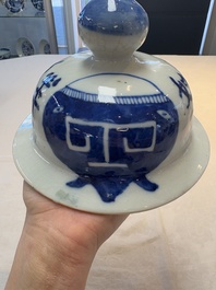 A Chinese blue and white vase and cover with calligraphy and antiquities, 19th C.