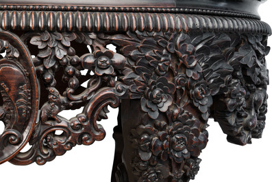 A Chinese finely carved hongmu marble top oval table, Canton, 19th C.