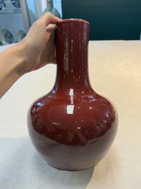A Chinese copper-red-glazed bottle vase, 19th C.