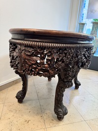A Chinese finely carved hongmu marble top oval table, Canton, 19th C.