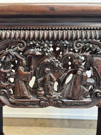 A Chinese finely carved hongmu marble top oval table, Canton, 19th C.