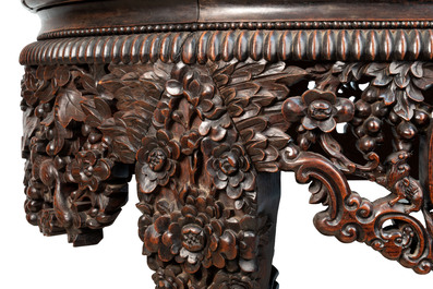 A Chinese finely carved hongmu marble top oval table, Canton, 19th C.