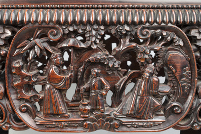 A Chinese finely carved hongmu marble top oval table, Canton, 19th C.