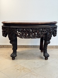 A Chinese finely carved hongmu marble top oval table, Canton, 19th C.