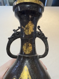 A Chinese parcel-gilt bronze vase with dragon-form handles, Yuan/Ming