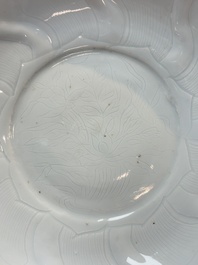 A Chinese moulded white-glazed plate with anhua floral design, Xuande mark, Ming