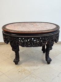 A Chinese finely carved hongmu marble top oval table, Canton, 19th C.