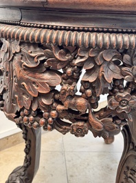 A Chinese finely carved hongmu marble top oval table, Canton, 19th C.