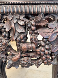 A Chinese finely carved hongmu marble top oval table, Canton, 19th C.