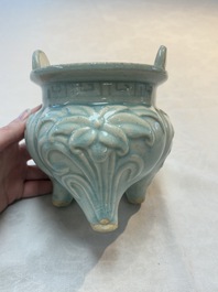 A Chinese qingbai tripod censer with floral relief design, Song/Yuan