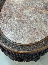 A Chinese finely carved hongmu marble top oval table, Canton, 19th C.