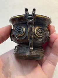 A Chinese archaistic gold and silver-inlaid bronze miniature censer, Ming