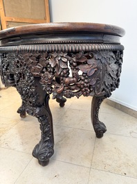 A Chinese finely carved hongmu marble top oval table, Canton, 19th C.