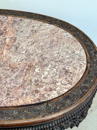 A Chinese finely carved hongmu marble top oval table, Canton, 19th C.