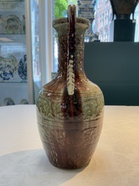A Chinese peachbloom-glazed vase with dragon-form handles, 18th C.
