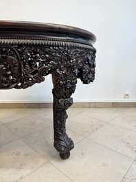 A Chinese finely carved hongmu marble top oval table, Canton, 19th C.