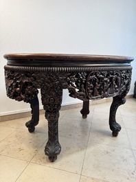 A Chinese finely carved hongmu marble top oval table, Canton, 19th C.