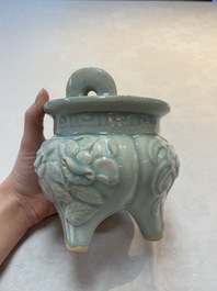 A Chinese qingbai tripod censer with floral relief design, Song/Yuan