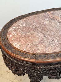 A Chinese finely carved hongmu marble top oval table, Canton, 19th C.