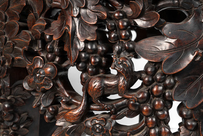 A Chinese finely carved hongmu marble top oval table, Canton, 19th C.