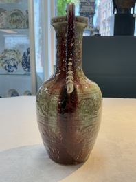 A Chinese peachbloom-glazed vase with dragon-form handles, 18th C.