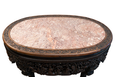 A Chinese finely carved hongmu marble top oval table, Canton, 19th C.