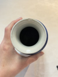 A Chinese blue and white powder-blue-ground 'Zhang Qian Cheng Cha 張騫乘槎' rouleau vase, Kangxi