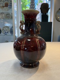 A Chinese flamb&eacute;-glazed vase with 'chilong' handles, 19th C.